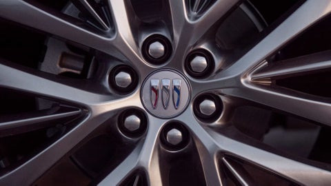 The 2024 Lincoln Corsair® SUV with the Jet Appearance Package and a Pristine White exterior is parked on a city street. | Lou Bachrodt Family of Dealerships in Rockford IL